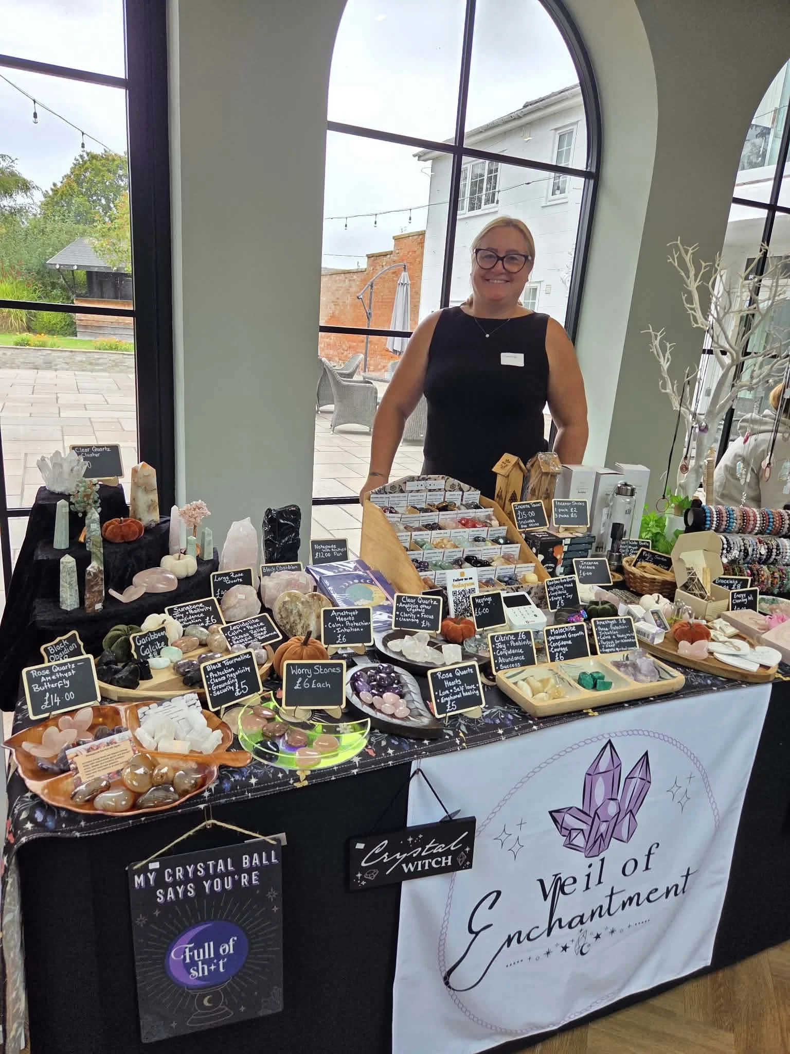 The Veil of Enchantment stall at a wellness event